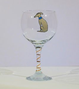 greyhound glasses,glasses with greyhounds on,greyhound drinking glass,greyhounds on glass,sitting hounds,sitting greyhounds,greyhound beer glass,beer glass with greyhounds on,whisky tumbler,greyhound whiskey,greyhound whisky,greyhound tumbler,blue gin glass,blue glass, greyhound gin,greyhound gin glass,gin glass with greyhound on,